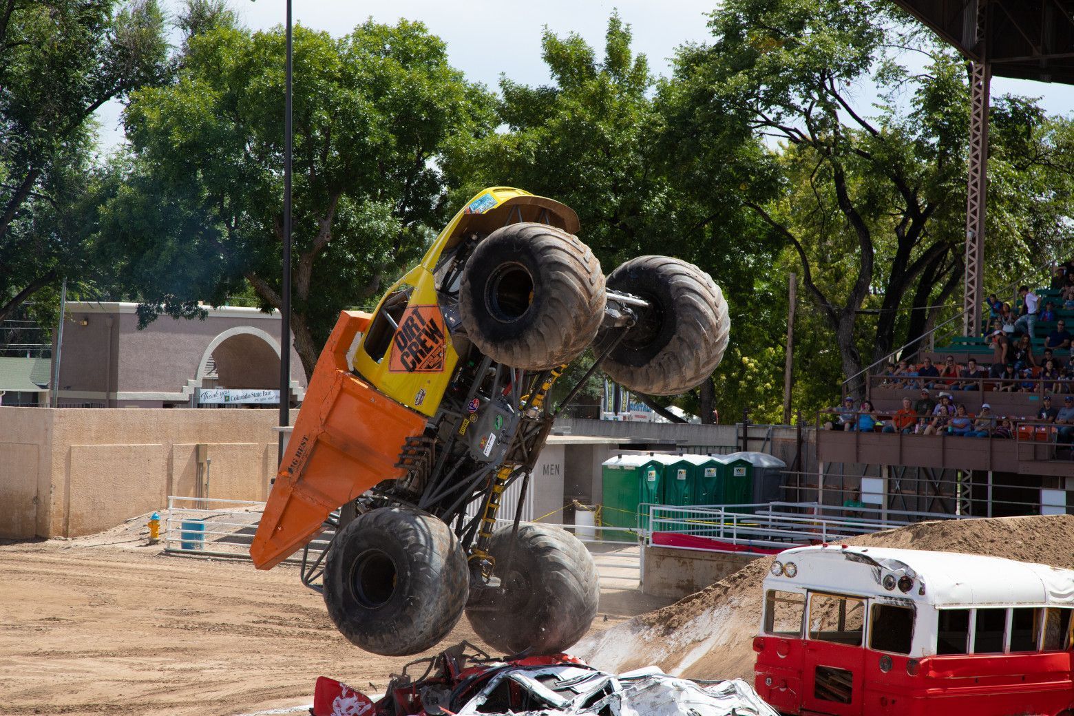 The Dirt Crew monster truck driving high off a ramp and catching some air at the Colorado State Fair