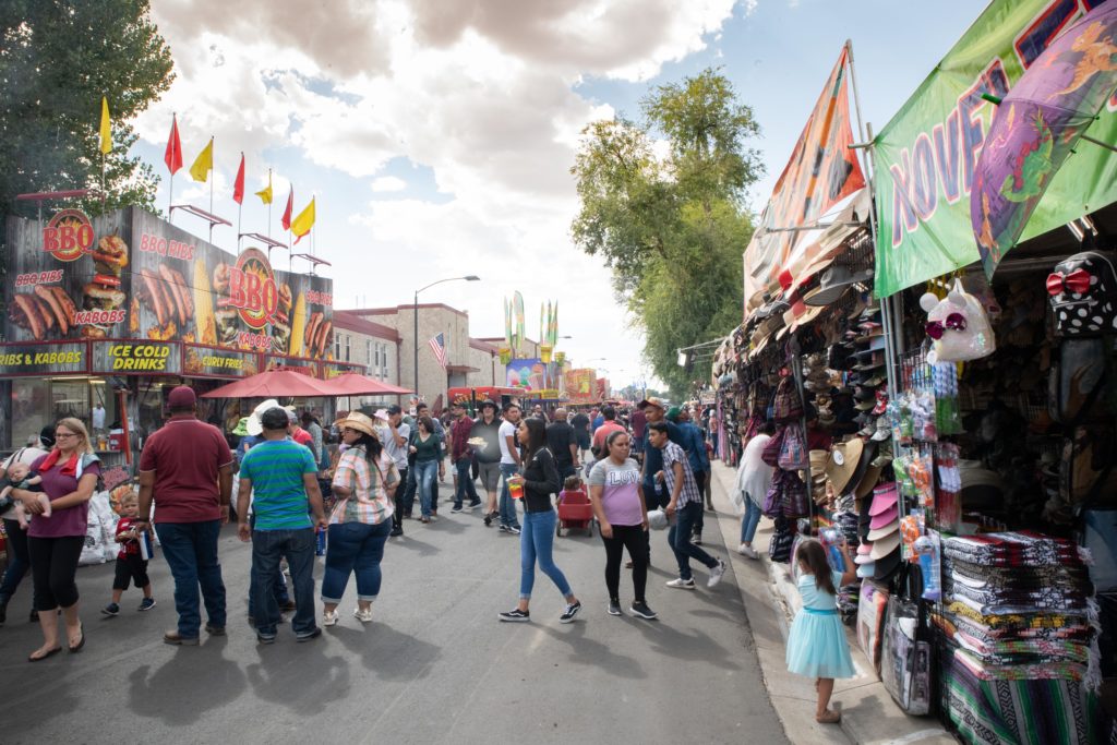 Main Street of Fair with vendors and customers