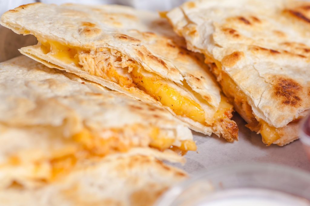 A closeup of a grilled chicken quesadilla