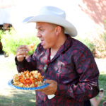 A man eating a meal at the Colorado State Fair