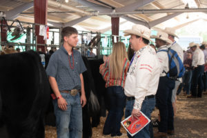 A judge talks to a 4-H contestant at the Colorado State Fair