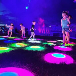 kids stepping on colorful lights