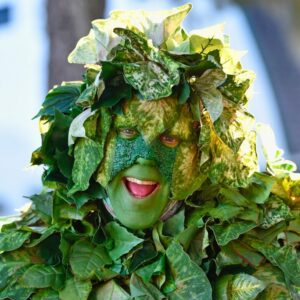 The man covered in leaves