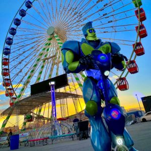 greenrobotferris-766×1024 (1) Rock-It the Robot in front of ferris wheel